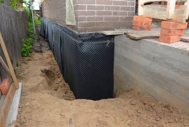 Happy homeowners after waterproofing job in Hiram